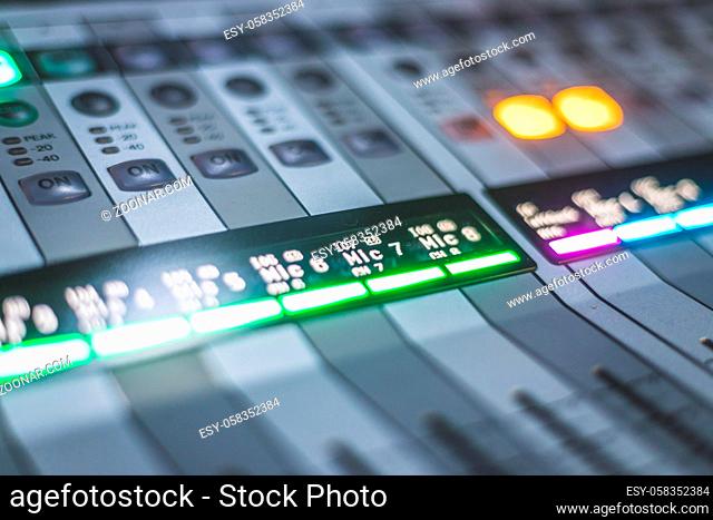 Professional music production in a sound recording studio, mixer desk