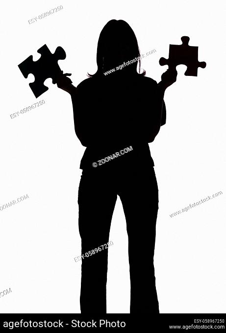 isolated on white silhouette of woman with puzzle