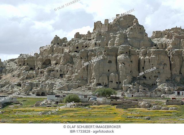 Dungkar caves with Tibetan village at front built in the traditional architectural style of the Tibetans in the ancient Kingdom of Guge, Western Tibet
