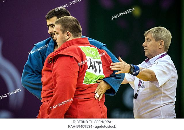 Kevin Rasit Cekic (red) of Austria competes with Razmik Tonoyan from Ukraine in the Sambo - Men's +100kg at the Baku 2015 European Games in Heydar Aliyev Arena...