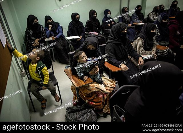 17 November 2022, Afghanistan, Kabul: Women are being trained as police officers in a classroom at a police barracks. Many of the women are the sole...