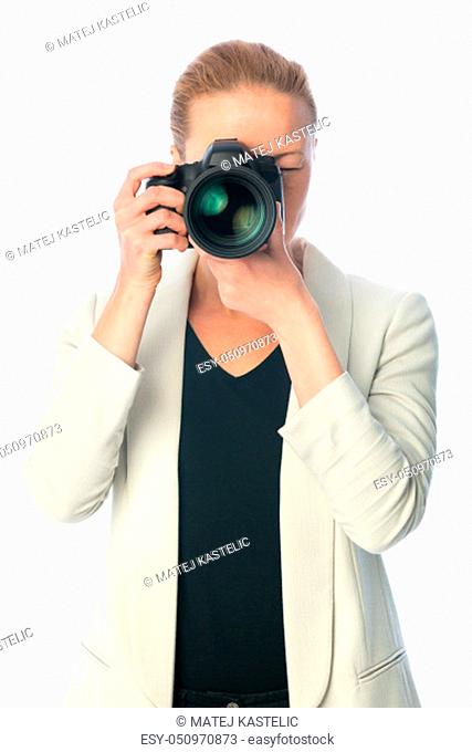 Woman photographer taking images with dslr camera isolated on white background