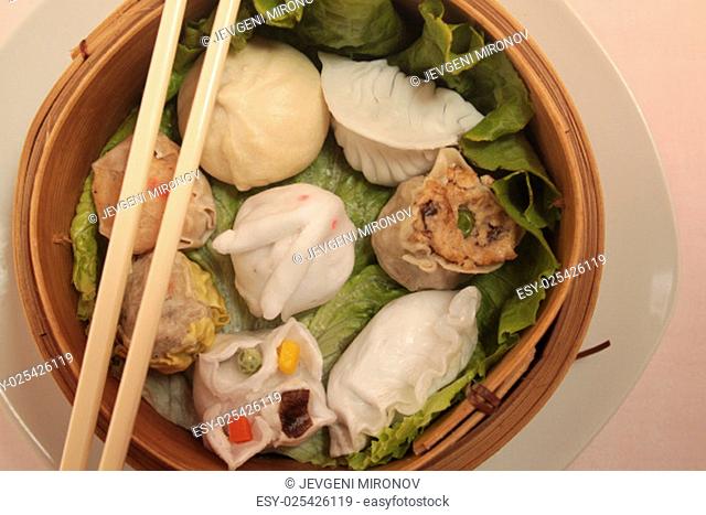 asian wontons in wooden bowl
