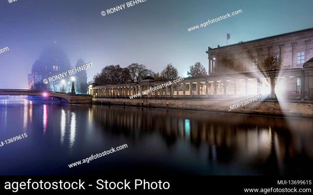 Illuminated Berlin Cathedral and Old National Gallery on Museum Island on the Spree at night