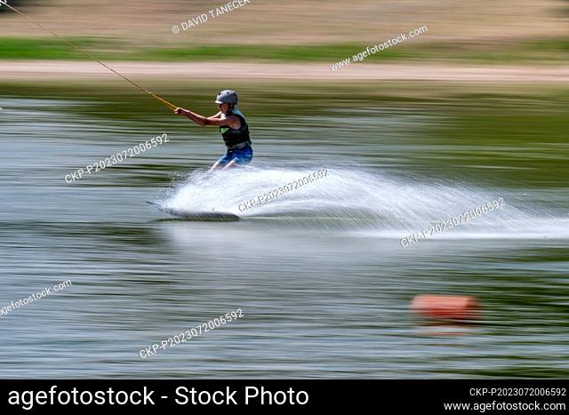 Man rides on the wakeboard on the Silver Pond (Stribrny rybnik) near Hradec Kralove, July 20, 2023. (CTK Photo/David Tanecek)