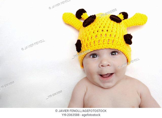 Baby girl in giraffe hat