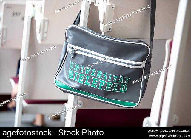23 September 2021, North Rhine-Westphalia, Bielefeld: A bag with the inscription Bielefeld University hangs in a lecture hall on the occasion of the launch of...