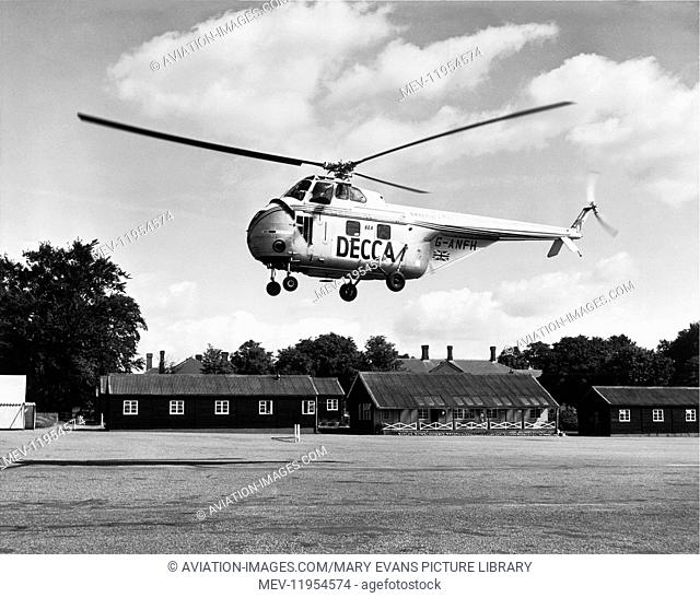 Bea Helicopters British European Airways Sikorsky Westland Ws-55 Whirlwind Series 1 Flying with Special-Livery Titles of Decca with Airport Buildings Behind
