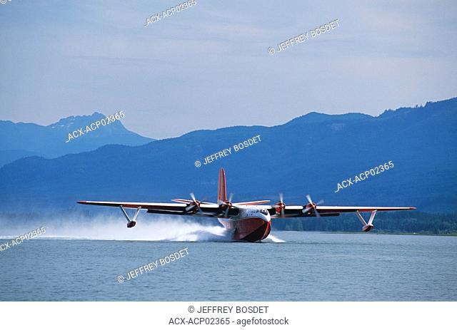 Martin Mars water bomber with Vancouver Island beyond, Baynes Sound, Strait of Georgia, british columbia, canada