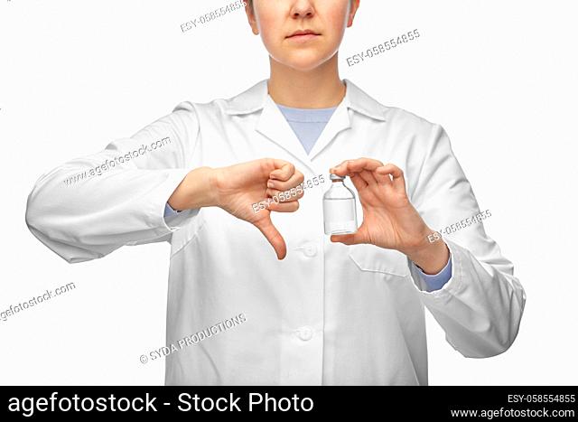 female doctor with medicine showing thumbs down