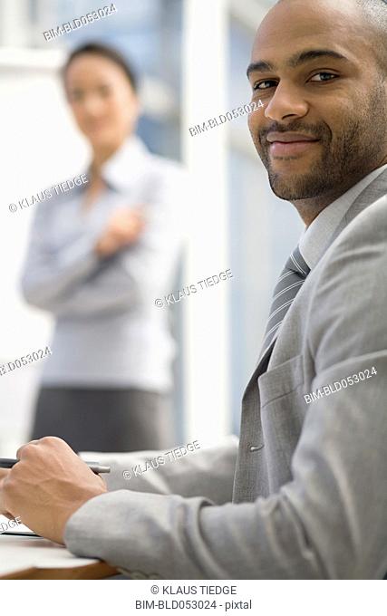 African businessman sitting at table