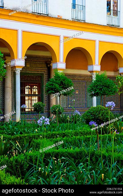 Courtyard with garden in Casa de Pilatos, Seville, Andalusia, Spain
