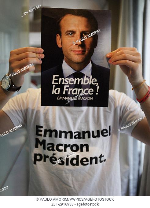 Emmanuel Macronâ. . s supporter Gael Bruyns , 19 years old poses for the pictures with a poster of President of the political movement 'En Marche !' (Onwards