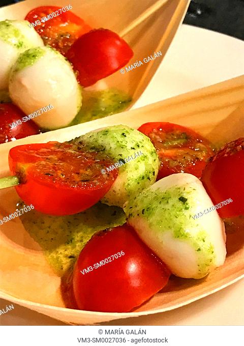 Cherry tomatoes with cottage cheese and parsley sauce