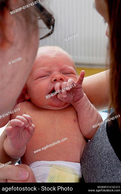 The pediatrician checks the general condition and tone of the newborn during the examination. Saint Vincent de Paul Hospital, Lille