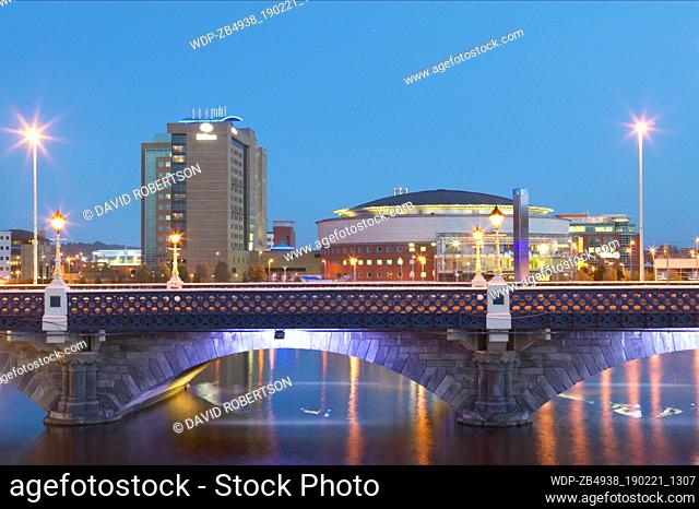 Northern Ireland, Belfast, Laganside, Queens Bridge, the Hilton Hotel and the Belfast Waterfront Hall at dusk