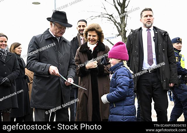 Sweden's King Carl XVI Gustaf and Queen Silvia receive a map from a young admirer while walking to Stora torget in Nykoping during the royal visit to...