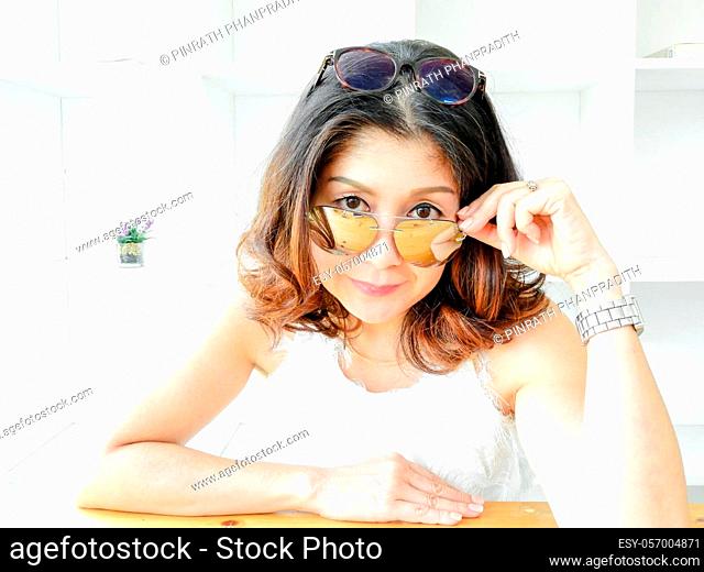Beautiful Woman Covering Face Under Glasses