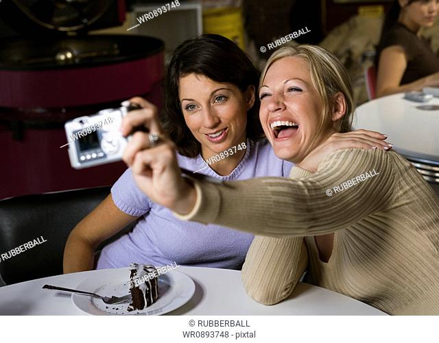High angle view of two women taking a photograph of themselves