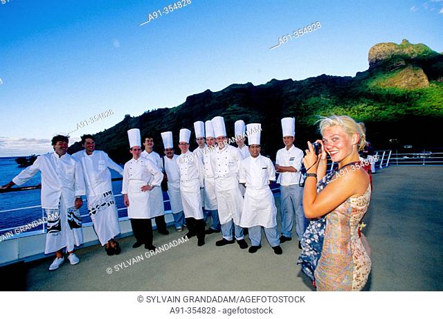Chefs and cooks posing for picture at deck of MS Paul Gauguin. French Polynesia
