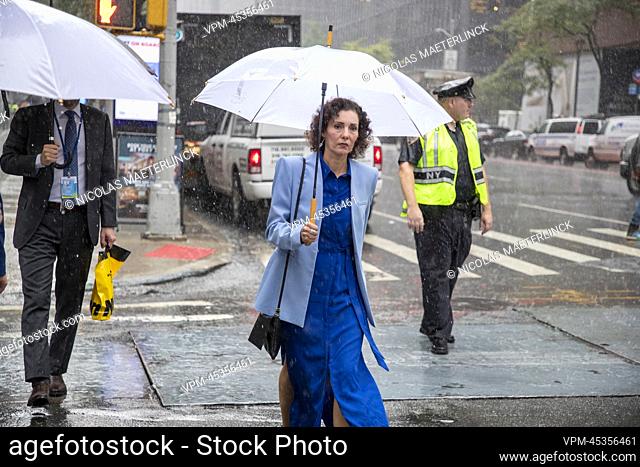 Foreign minister Hadja Lahbib pictured walking with an umbrella in the streets of New York City during the 77th session of the United Nations General Assembly...