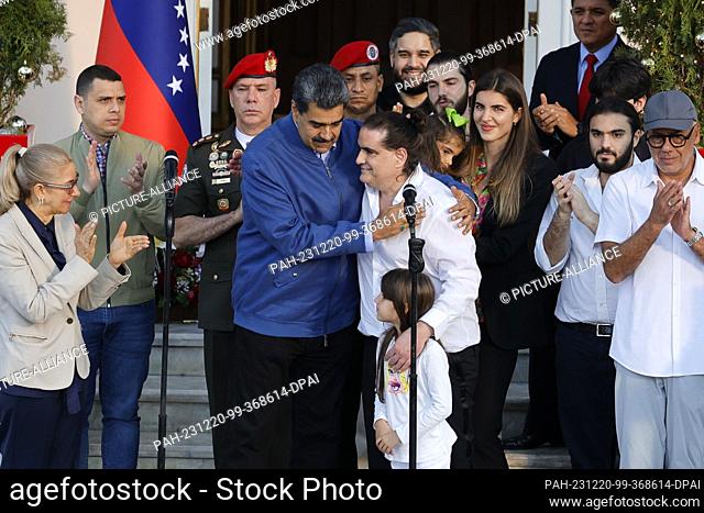 20 December 2023, Venezuela, Caracas: Nicolás Maduro (4th from left), President of Venezuela, greets Alex Saab (M), Colombian businessman