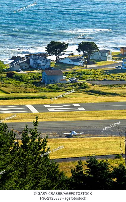 Airplane, runway, houses, and ocean at Shelter Cove, on the Lost Coast, Humboldt County, California