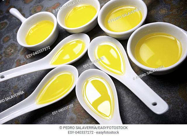 Olive oil in a small china spoons