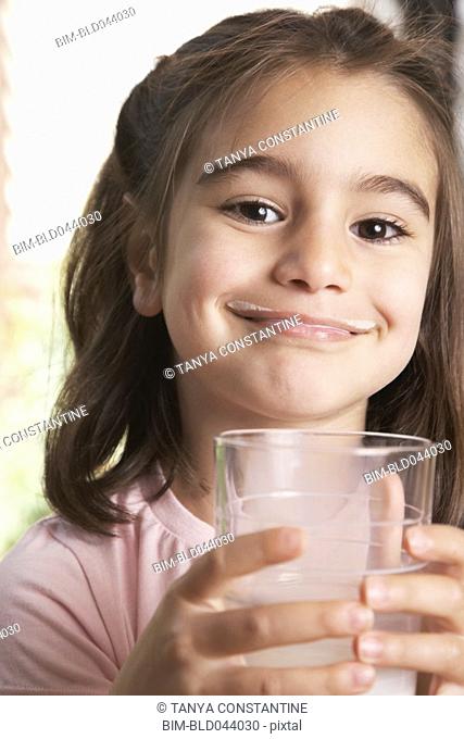 Middle Eastern girl drinking milk