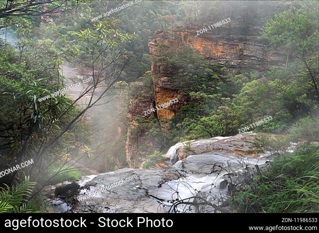 Water fed by the Jamison Creek flows over the cliff edge at Wentworth Falls for a drop of around 187 metres to the bottom of the valley