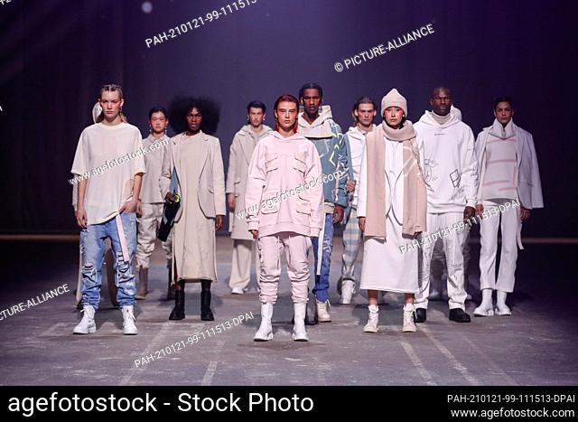 20 January 2021, Berlin: Designer Elias Rumelis shows off with models after his show on the catwalk he presented his collection for the fall/winter season...