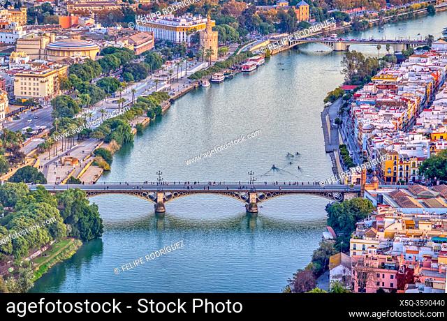 Aerial view of Triana (foreground) and San Telmo (background) bridges over the Guadalquivir river, Seville, Spain. High resolution vertical panorama
