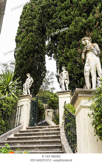 Achilleion palace, Corfu, Greece - August 24, 2018: Classical statues at the Achillion Palace on the island of Corfu