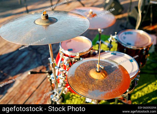 Music in the park, drums on background wooden floors . a holiday or a wedding outdoors. party in Park or forest