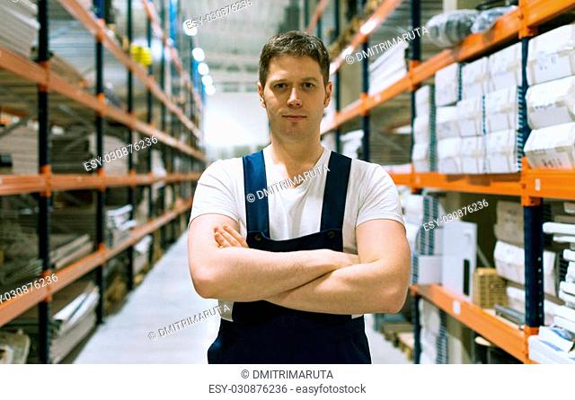 Handsome supervisor with at the warehouse. Space for text
