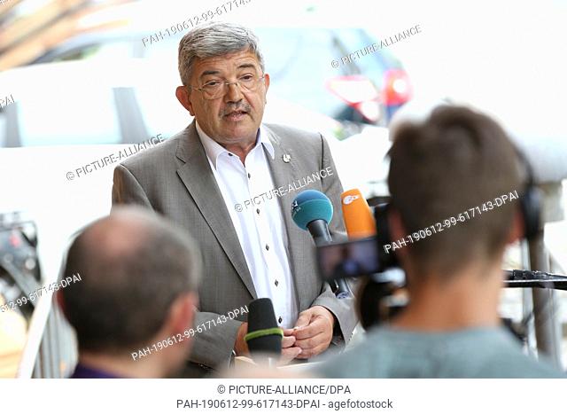 12 June 2019, Mecklenburg-Western Pomerania, Schwerin: Lorenz Caffier (CDU, r), Interior Minister of Mecklenburg-Western Pomerania, makes a press statement