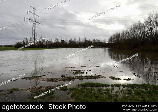12 February 2020, Mecklenburg-Western Pomerania, Rostock: On a meadow a small lake has formed after the continuous rain of the past days and weeks