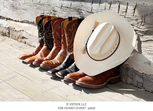 USA, Illinois, Metamora, Row of cowboy boots and cowboy hat