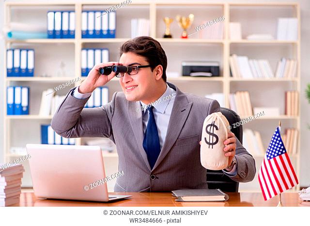 Businessman with American flag in office