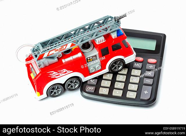 Calculator and toy fire truck isolated on white background