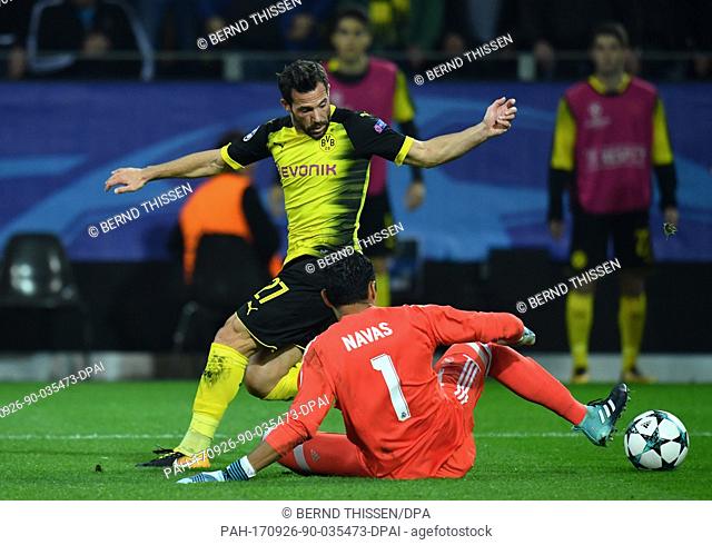Dortmund's Gonzalo Castro (l) and Madrids goalkeeper Keylor Navas vie for the ball during the UEFA Champions League football match between Borussia Dortmund and...