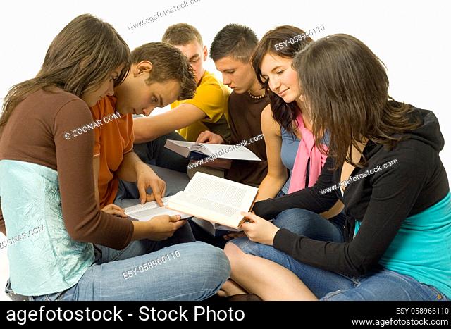 Group of students sitting and reading the books. White background