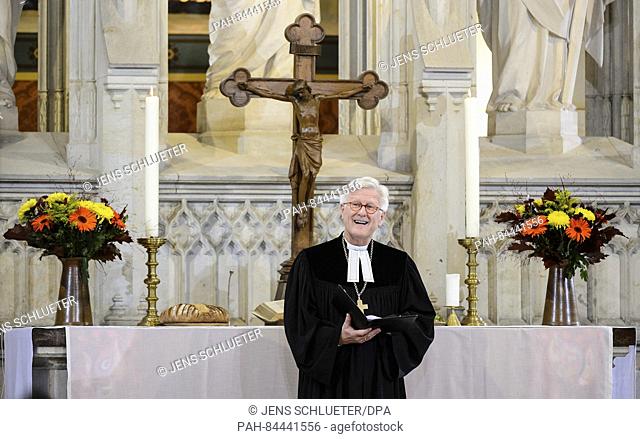 the president of the Evangelical Church in Germany council, Heinrich Bedford-Strohm, stands during the service for the re-opening of the All Saints' Church in...