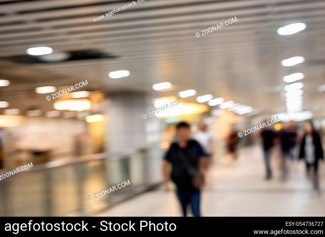 abstract background with people walking in the modern building