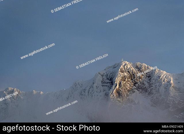 The Tiefkarspitze in winter with clouds and gentle evening light