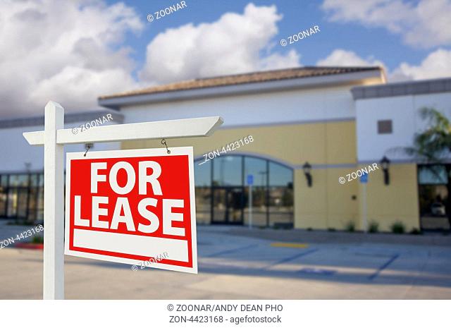Vacant Retail Building with For Lease Real Estate Sign in Front