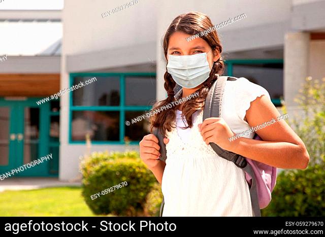 Hispanic Student Girl Wearing Face Mask with Backpack on School Campus