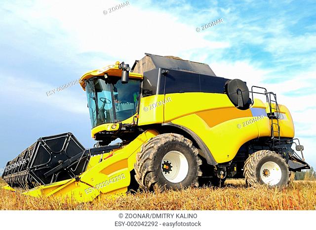 combine harvester during field work on farm