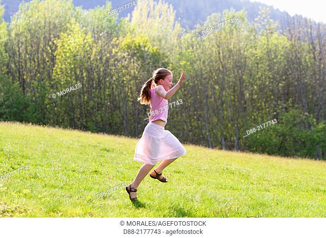France, Bas Rhin, Urbeis near the Climont, girl in a meadow