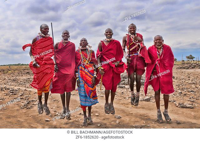 Kenya Africa Amboseli Masai men in red costume dress and beads in Amboseli National Park safari 1
